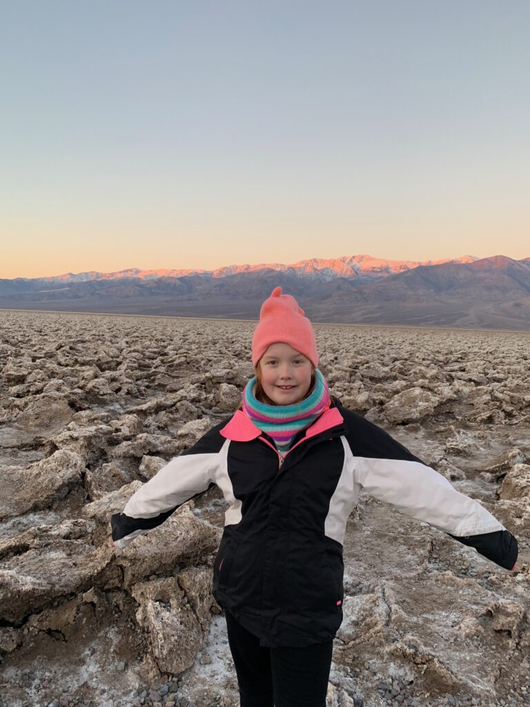 Cameron outside at sunrise in the middle of the Devils Golf Course in Death Valley California. 