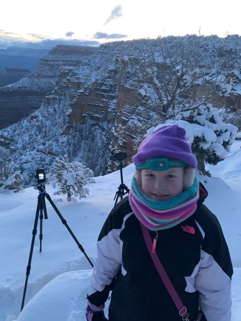 Cameron standing in the deep snow of the Grand Canyon in the Winter of 2019. On the Rim Trial just a bit away from Yavapai Point. Taken just before the dawn.