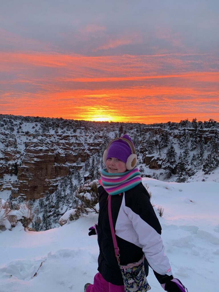 Cameron at Sunset in the Grand Canyon - with fresh snow on the ground and a bright red sky above. 