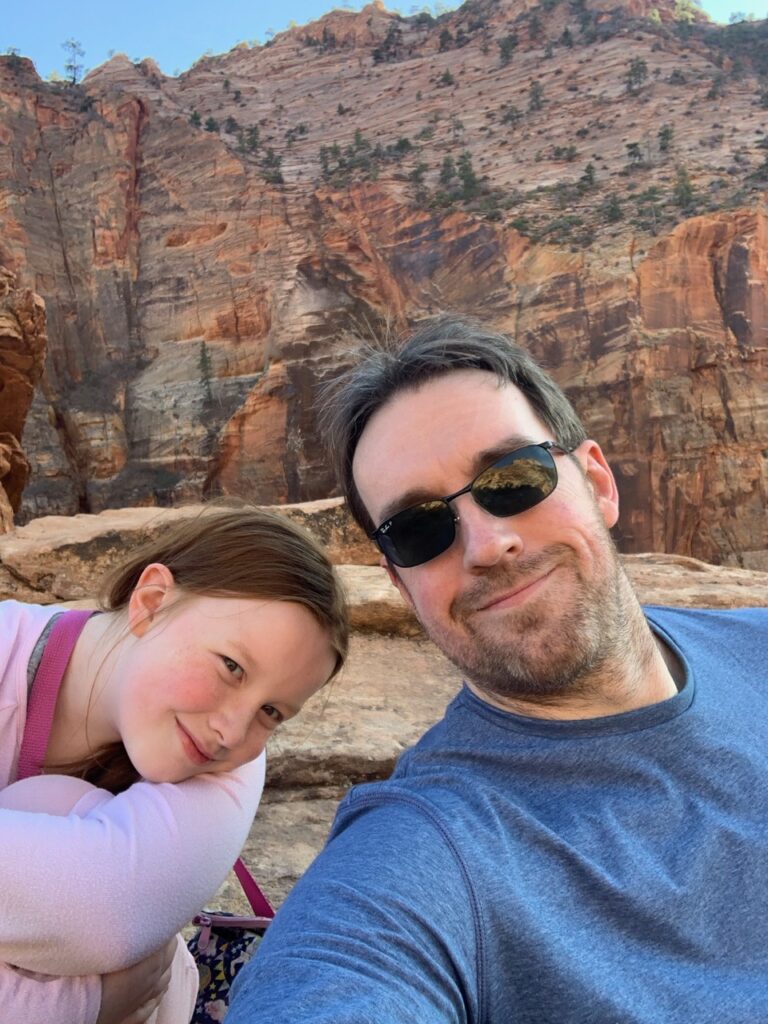 Cameron and myself sitting and taking a break at the end of the Canyon Overlook Trail in Zion National Park.