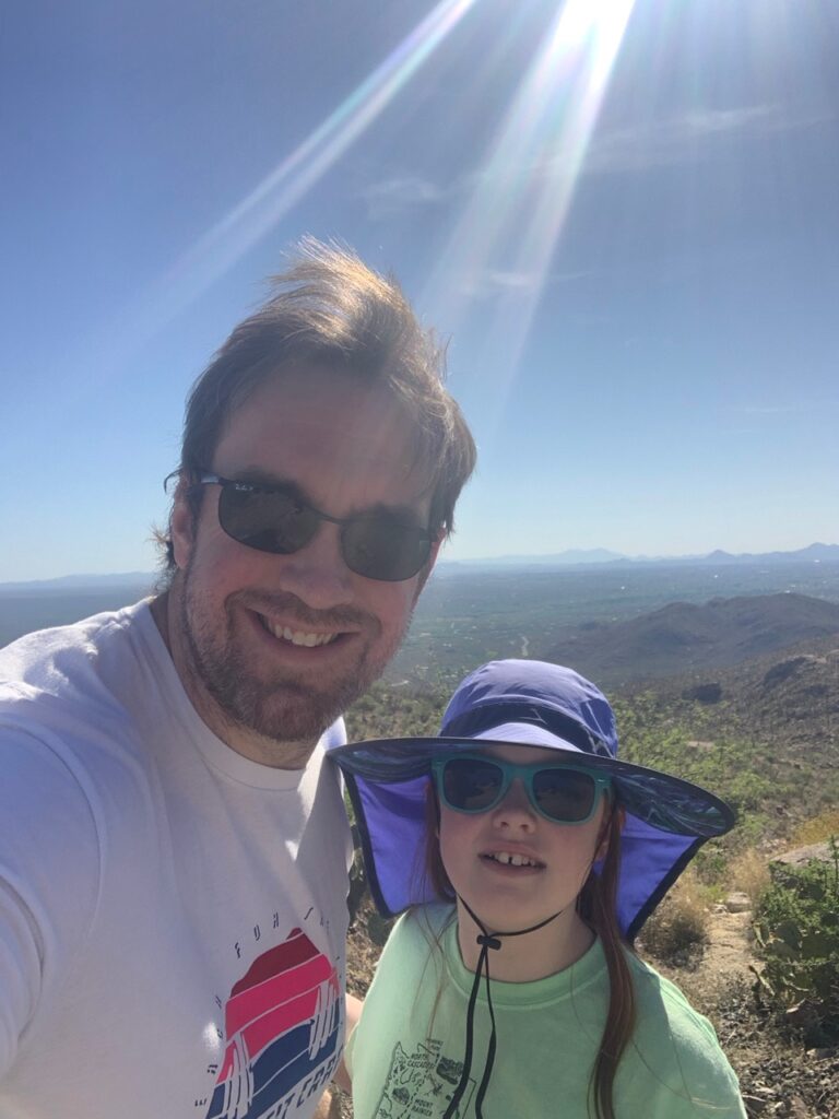 Cameron and myself standing on a hiking trail in the mid day of Saguaro National Park.