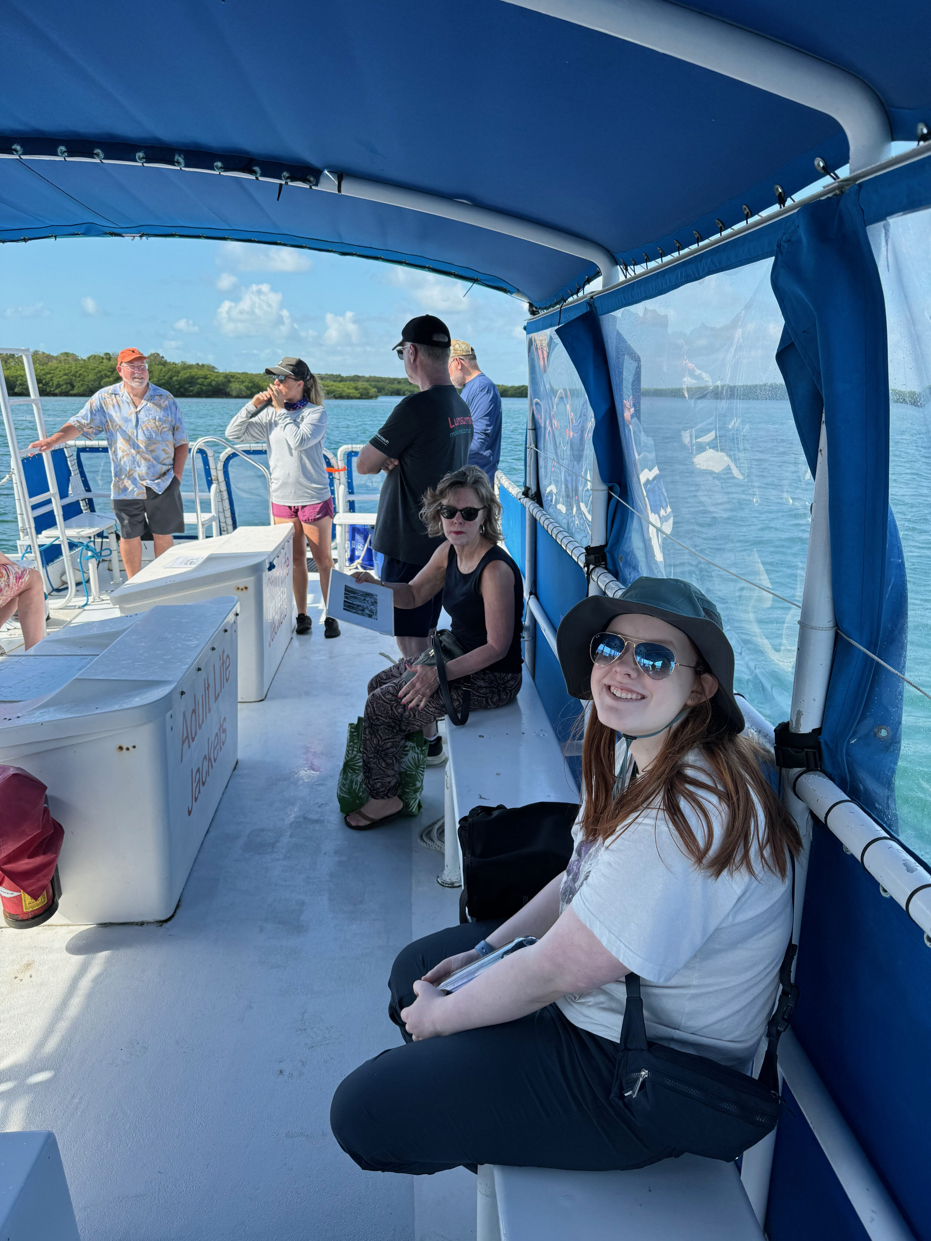 Cameron sitting on the covered section of the boat for the tour of all the key islands in Biscayne National Park.