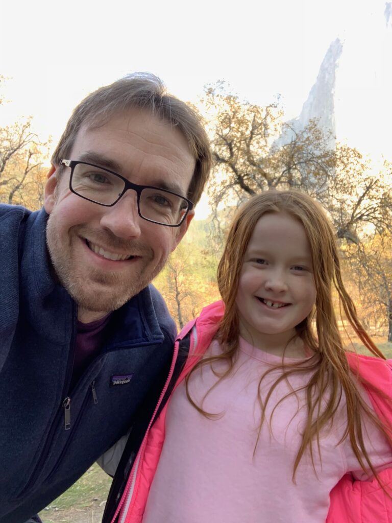 Cameron and Chris standing in Yosemite Valley in the middle of fall.