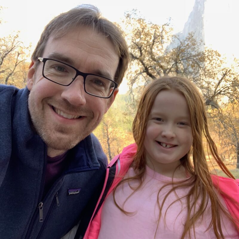 Cameron and Chris standing in Yosemite Valley in the middle of fall.