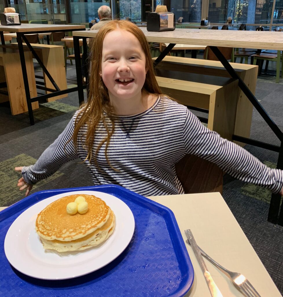 Cameron eating pancakes in the Base Camp Eatery in Yosemite Valley.