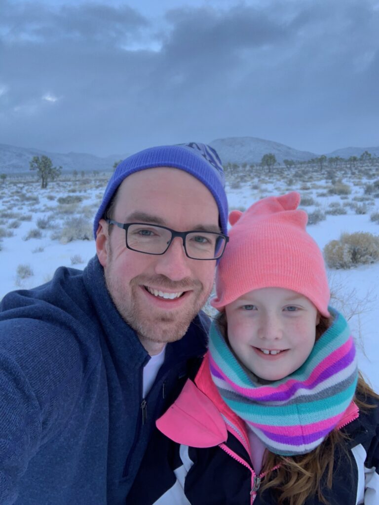 Cameron and myself standing in Joshua Tree National Park in the early morning in the snow.