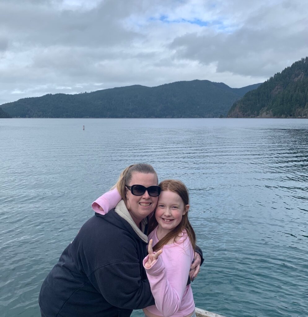 Cameron and Cat posing for a photo mid-day on the shores of Lake Crescent