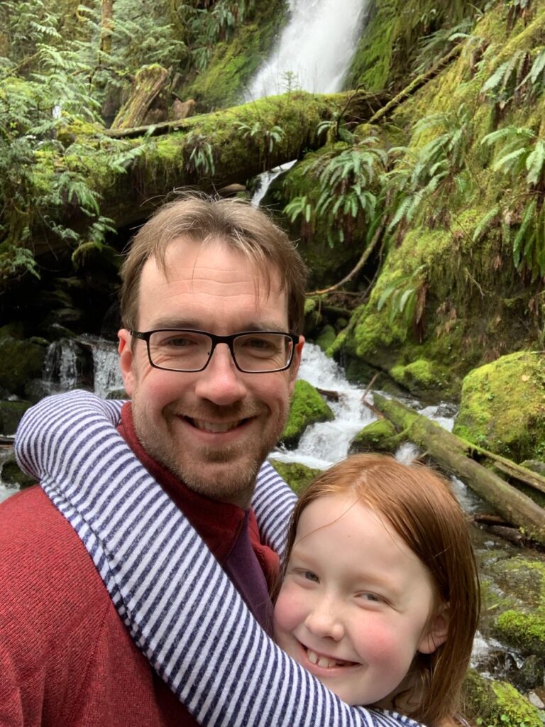 Cameron and myself standing in front of the Merriman Falls iwaterfall in the Lake Quinaul deep inside Olympic National Park.