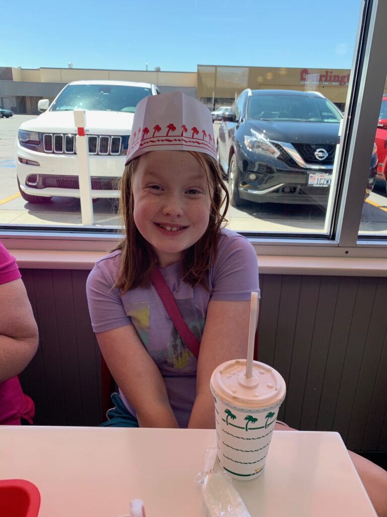 Cameron at In-n-Out Burger on the long drive around the parks in Utah.