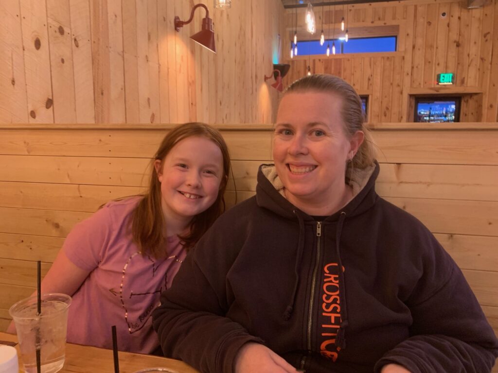 Cat and Cameron sitting down for dinner in the Badlands Saloon & Grille.