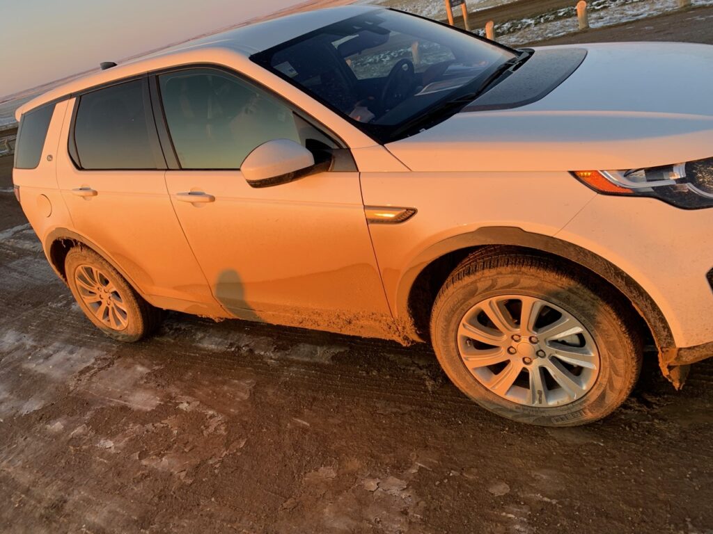 Our rental car after driving around the off roads about Badlands National Park. The cover is covered in dirt and mud from the recent snow and its melt.