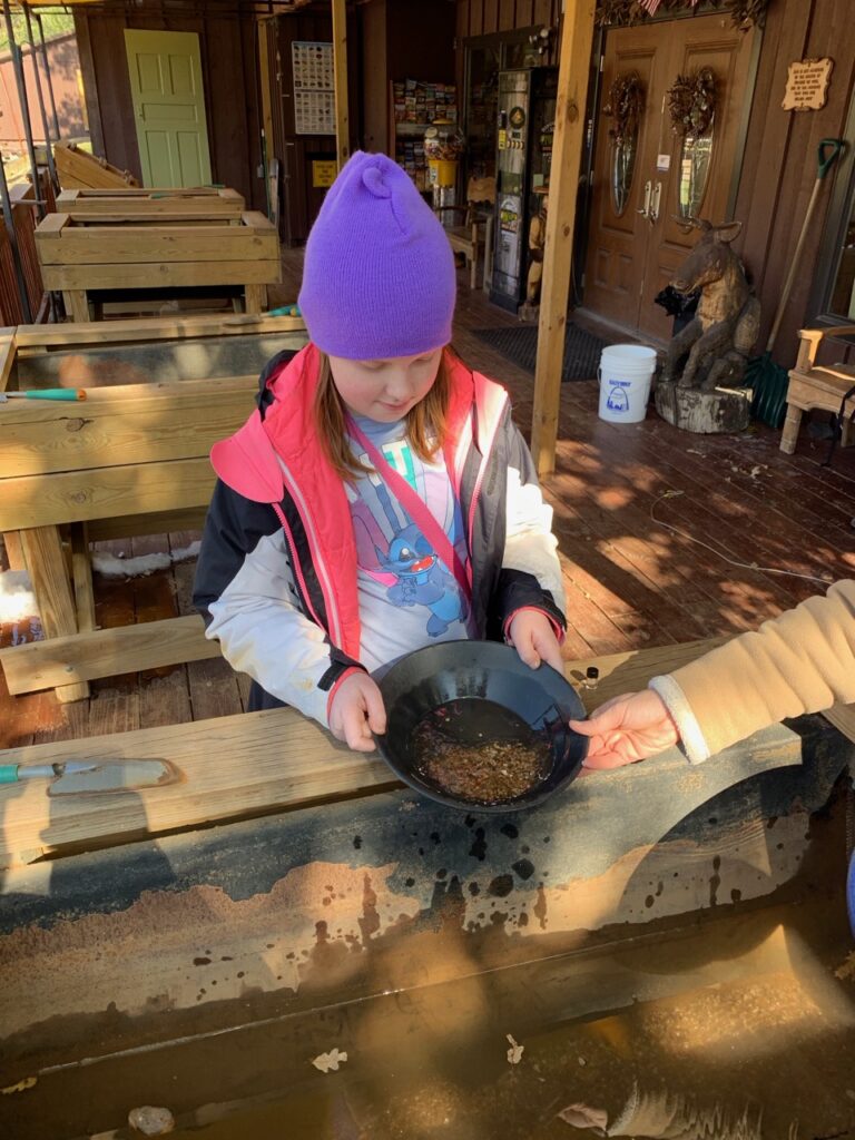 Cameron panning for gold at the Big Thunder Gold Mine in the Black Hills of South Dakota.