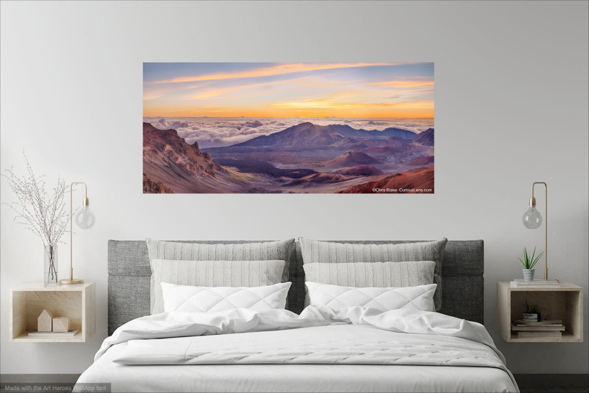 Photo of sunrise in Hawaii, taken on top of a volcano with a cloud inversion. Photo is printed and hung over a bed.