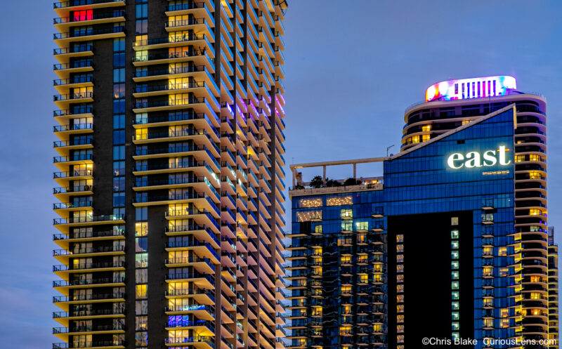 Brickell City Centre under construction during blue hour, Miami skyline with unique view, lighting, color, details, and symmetry.