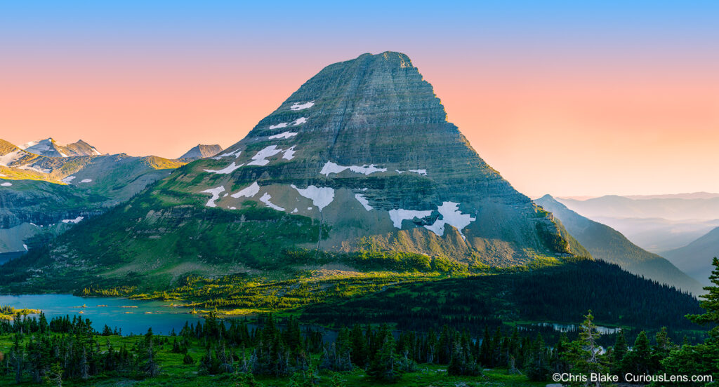 Hidden Lake Trail at Logan Pass in Glacier National Park with clear evening sky, Bearhat Mountain, and stunning sunset colors.