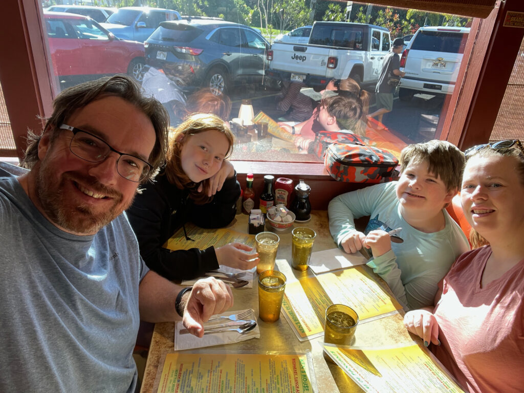 The family sitting at a table at Ken's House of Pancakes about to have an amazing breakfast. 