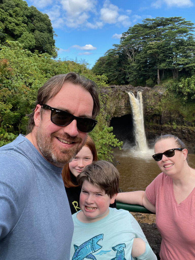 The entire family, Cat, Cameron, Collin and myself standing in front of the Wailuki River waterfall. 