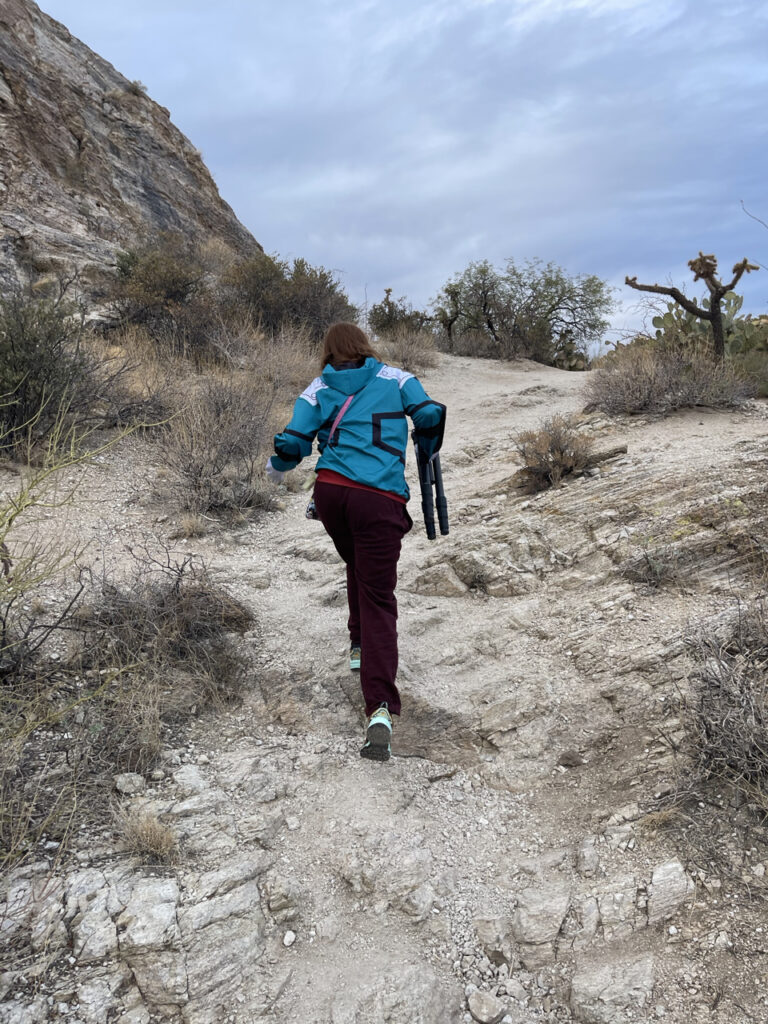 Cameron hiking up the mountain to Javelina Rocks while carrying my tripod on the East Side of Saguaro National Park.