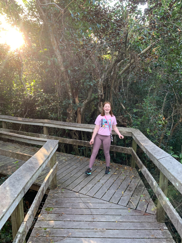 Cameron walking on the Mahogany Hammock Trail in Everglades National Park.