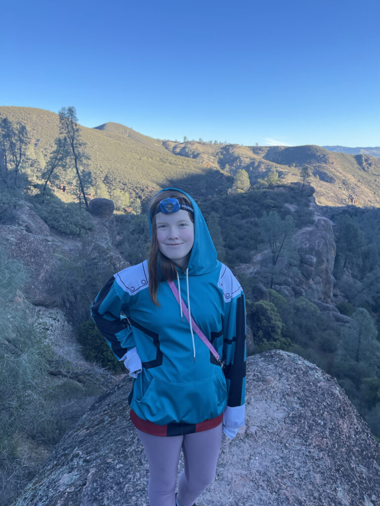 Cameron on a massive boulder on the Rim Trail in Pinnacles National Park. Taken just after sunrise and the first light is starting to hit the mountains in the background. 