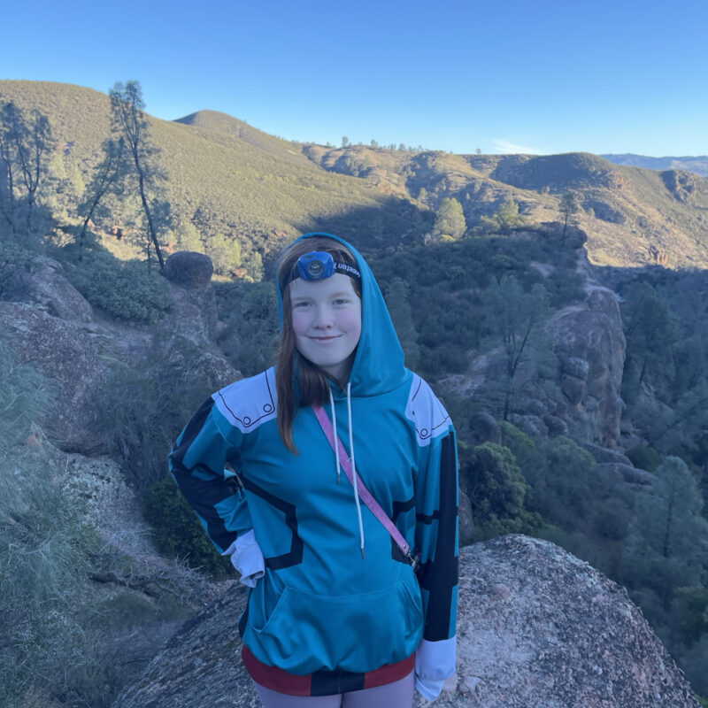 Cameron on a massive boulder on the Rim Trail in Pinnacles National Park. Taken just after sunrise and the first light is starting to hit the mountains in the background.