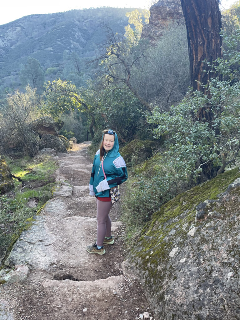 Cameron walking back down the High Peaks trail in Pinnacles National Park. All smiles as she still has her headlamp on form our pre-dawn hike to the top.