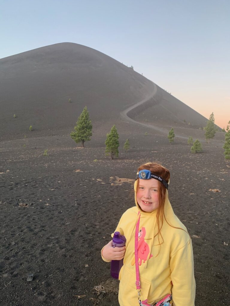 Cameron at the base of the Cinder Cone Volcano after a long pre-dawn hike. 