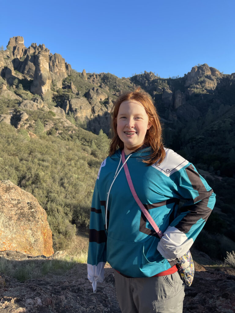 Cameron with a big smile as she poses on the West Side of Pinnacles National Park. Taken off the Juniper Canyon Trail.