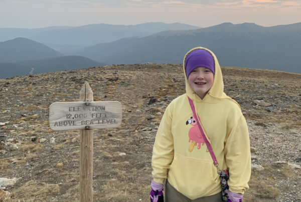 Cameron posing at sunrise on Alpine Ridge at an elevation of 12,005 feet.