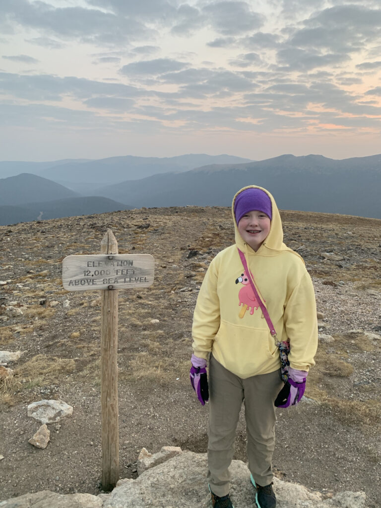 Cameron posing at sunrise on Alpine Ridge at an elevation of 12,005 feet.