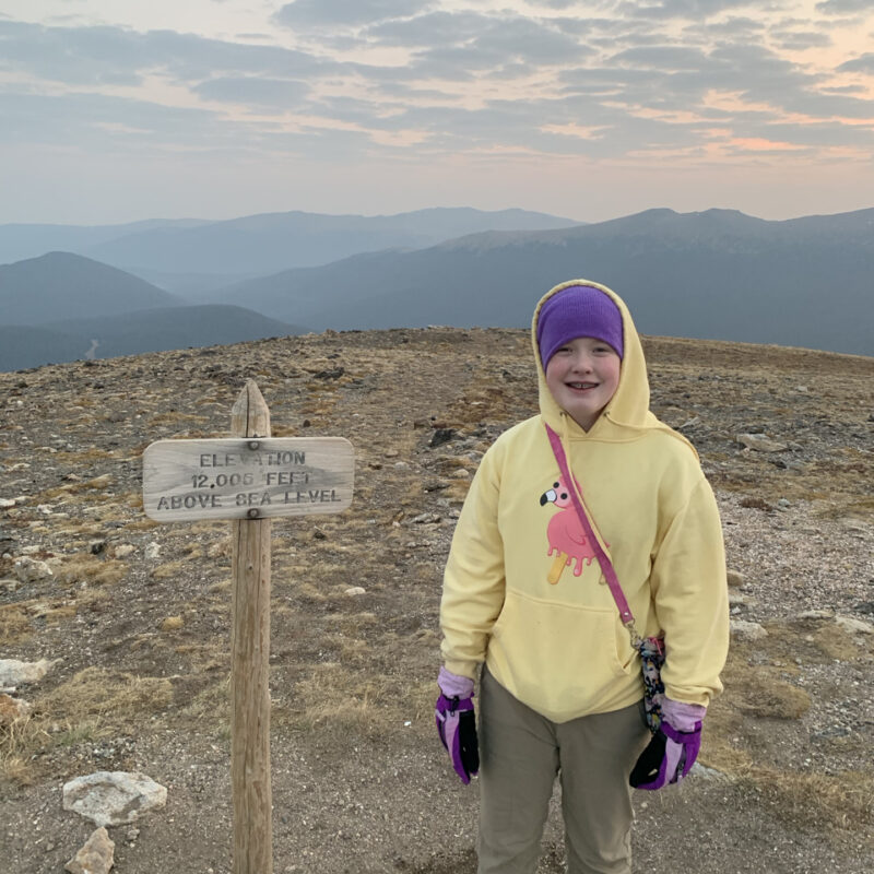 Cameron posing at sunrise on Alpine Ridge at an elevation of 12,005 feet.