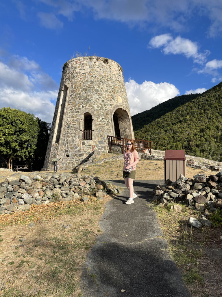 Cameron walking up the path to tour the Annaberg Sugar Mill in the US Virgin Islands. The day had bright blue sky with puffy clouds.