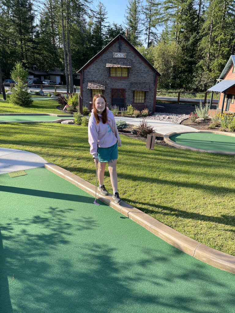 Cameron playing mini golf at Going to the Sun Mini Golf outside of Glacier. 