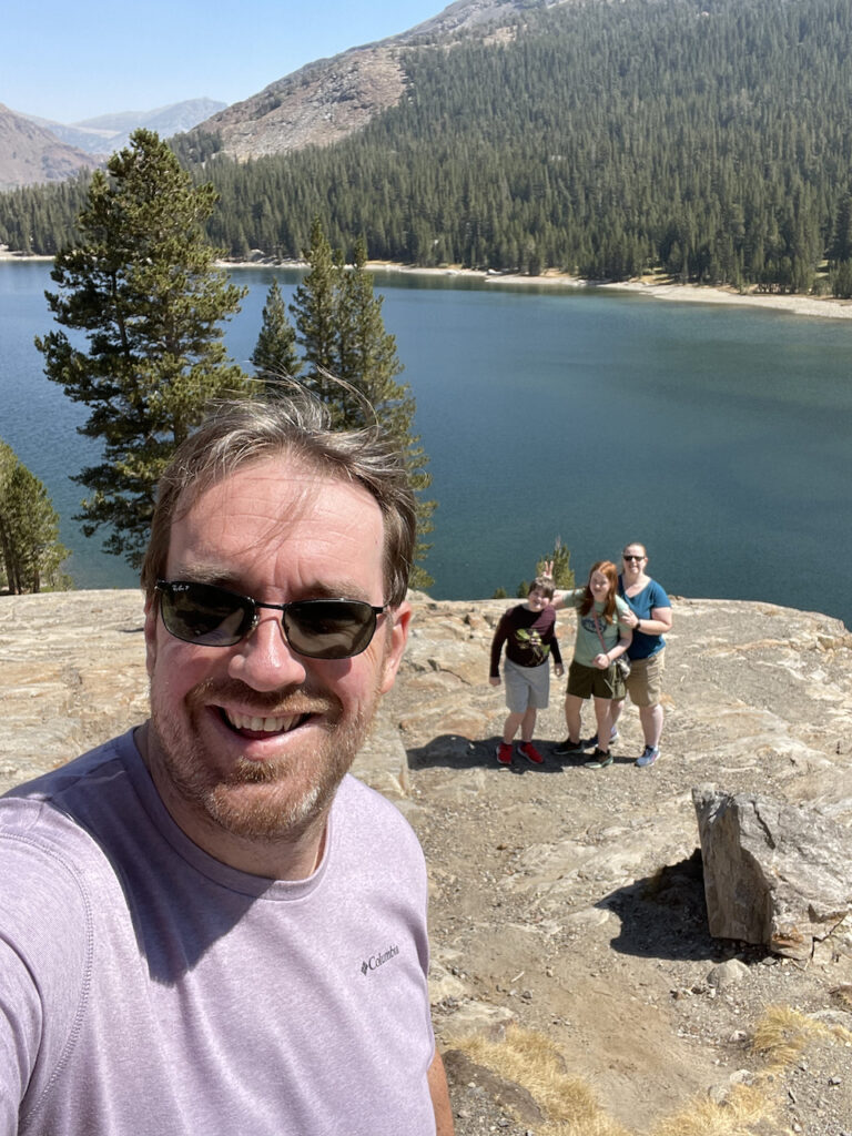 Myself in the foreground and Cat, Cami, and Collin way behind me and down on the rocks. Taken overlooking the shores of Tioga Lake in Yosemite National Park.