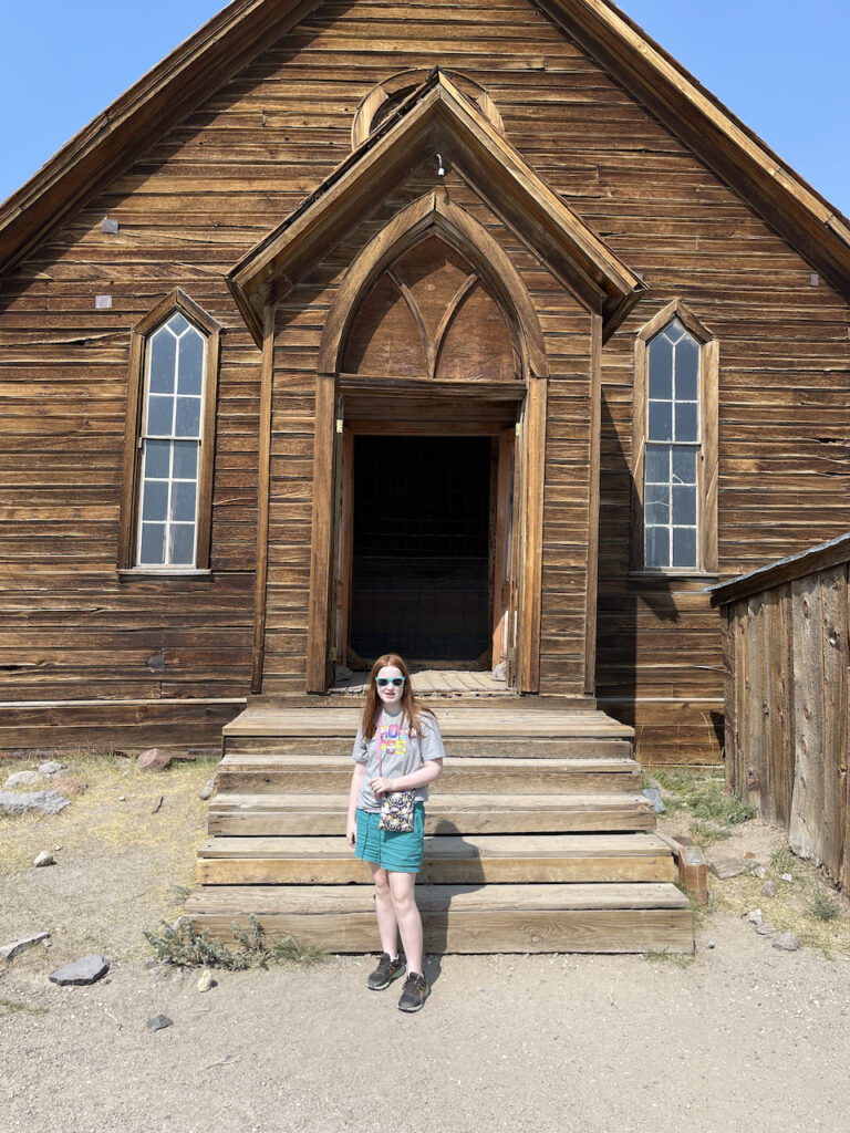 Cameron standing in front o the old Church in the massive Ghost Town of Bodie California. 