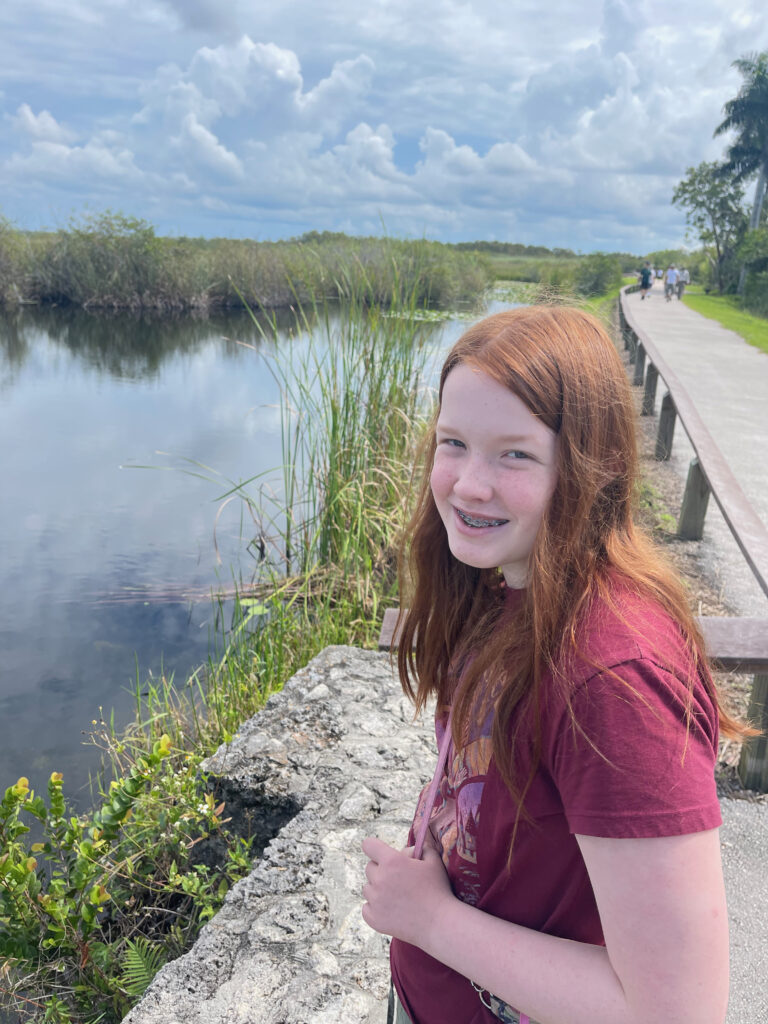 Cameron looking at me and smiling as we where hiking on the Anhinga Trail looking for wildlife in the Everglades. 