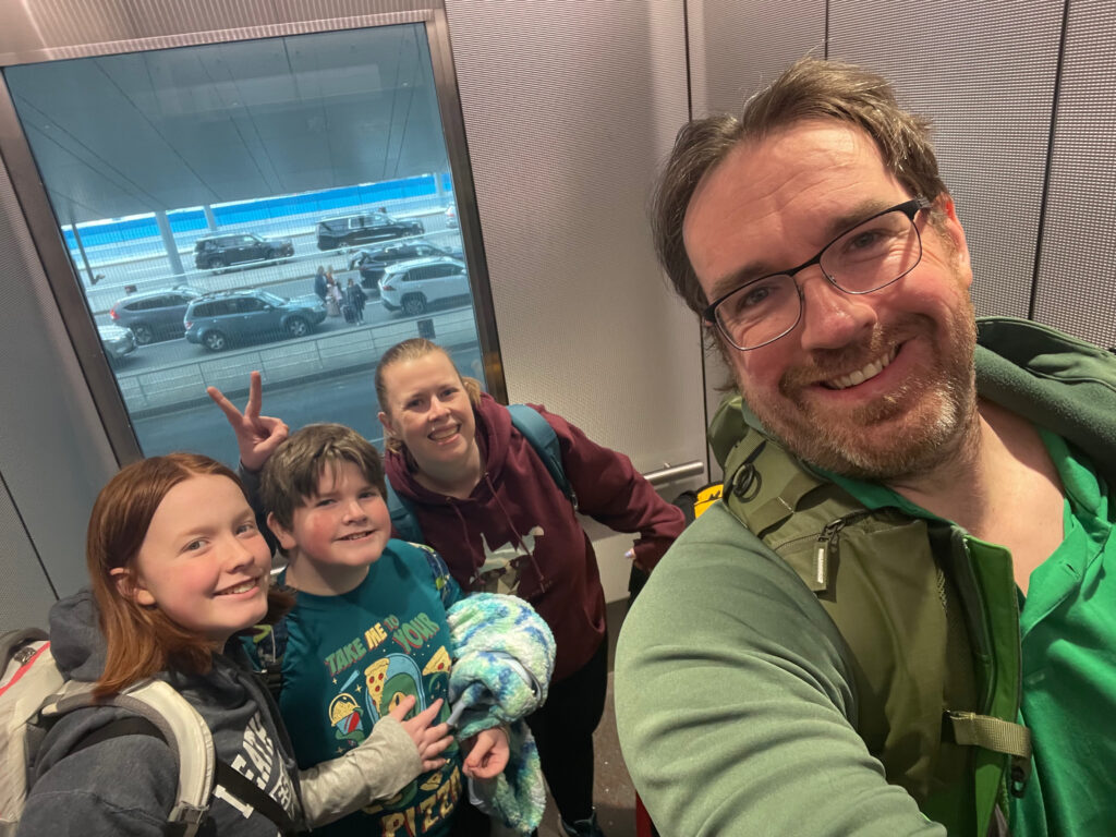 The entire family, Cat, Cameron, Collin and myself in an elevator at Boston Logan Airport, with all our bags about to head out to Oregon.