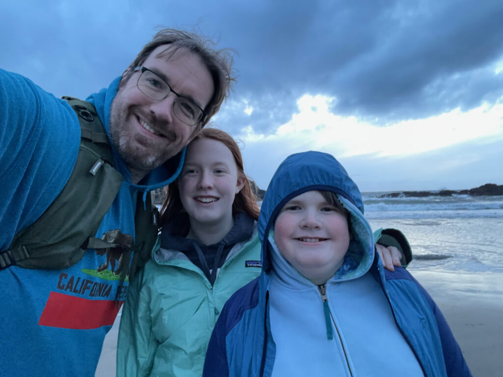 Myself, Cameron and Collin pose for a photo on Seal Rock beach right after sunset with storm clouds above us. 