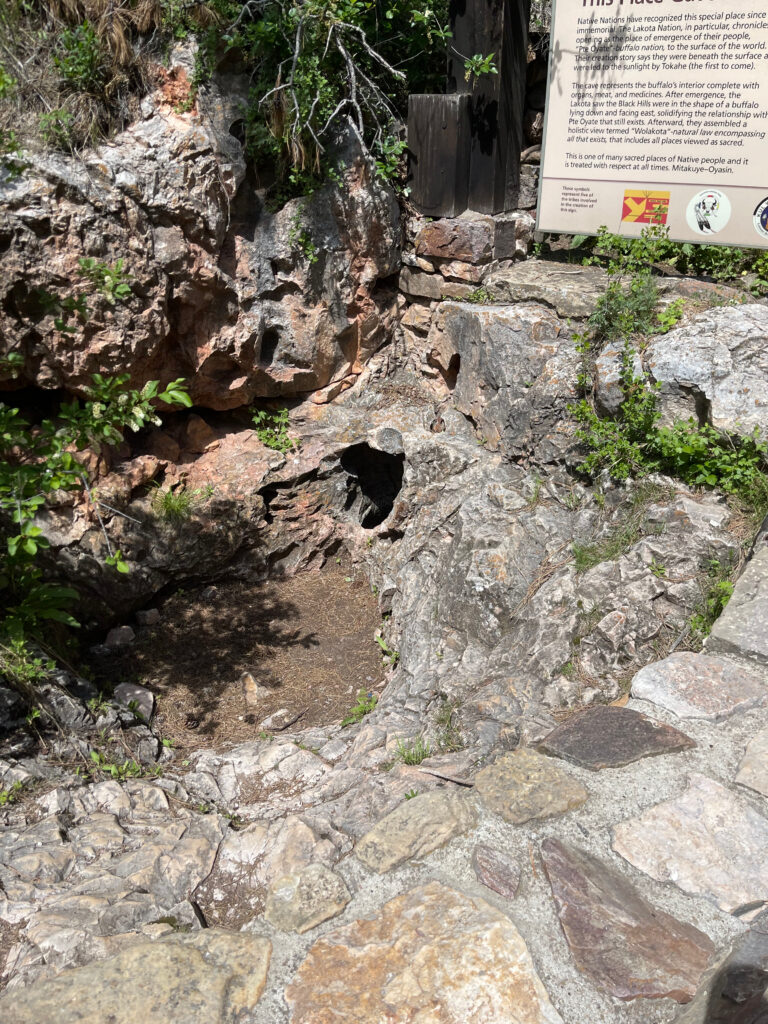 A picture of hole that leads into win cave, very small but you can feel that air 'breathing' in and out of the hole.