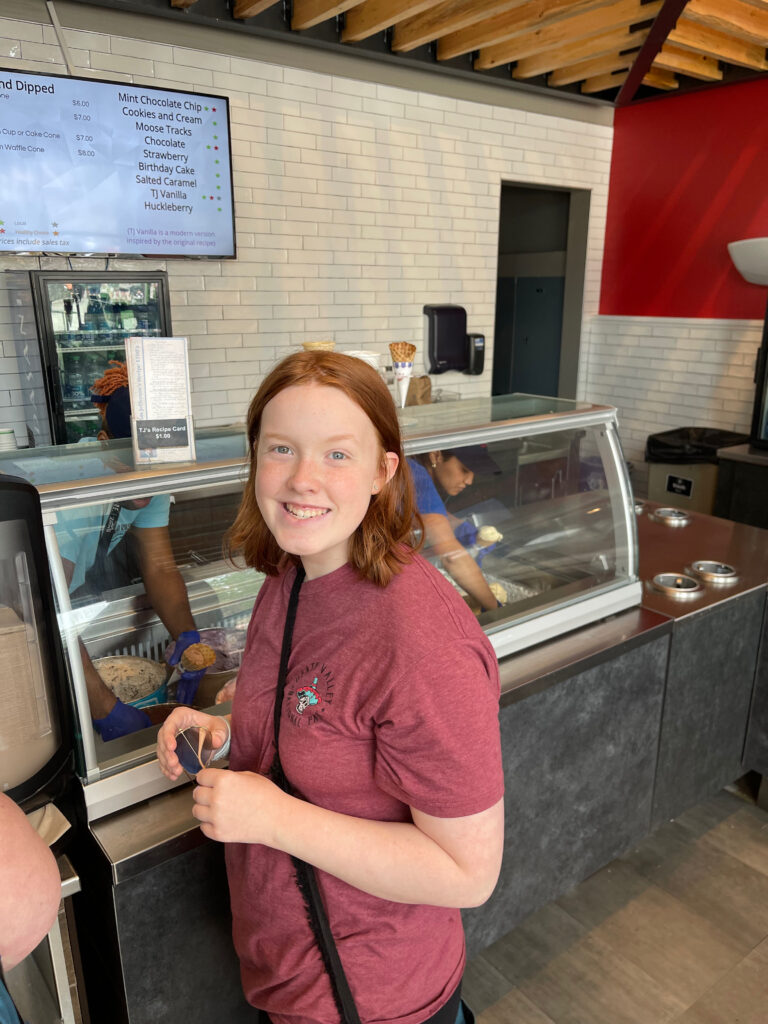 Cami with a huge smile on her face in line for the famous ice cream at Mount Rushmore.