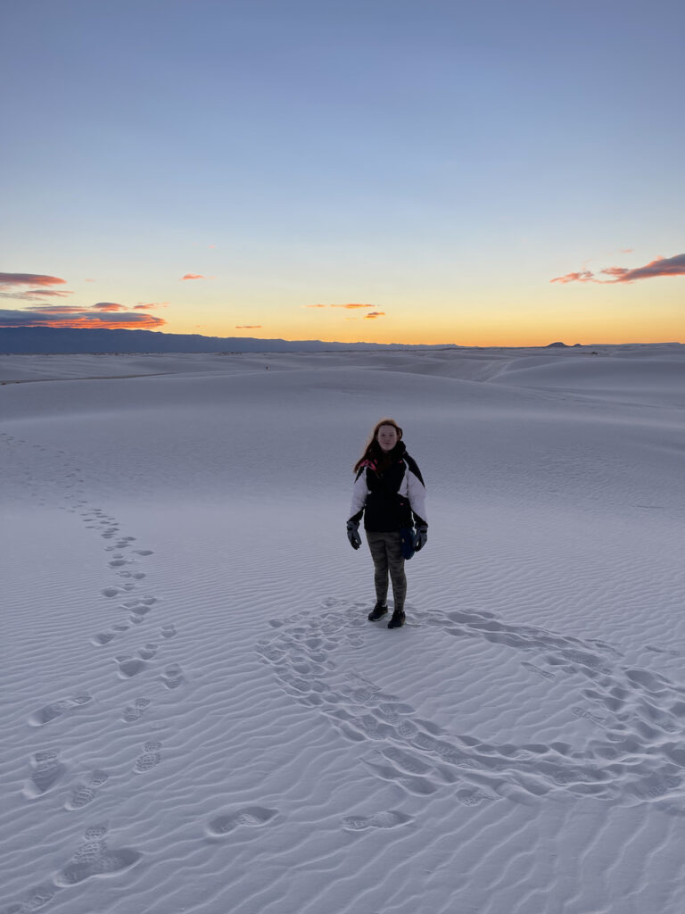 Cameron pre-dawn in White Sands National Park. You can see our footprints as we made our way deep into the sand dunes. Cami has make a circle of foot prints in the sand while waiting for the dawn. 