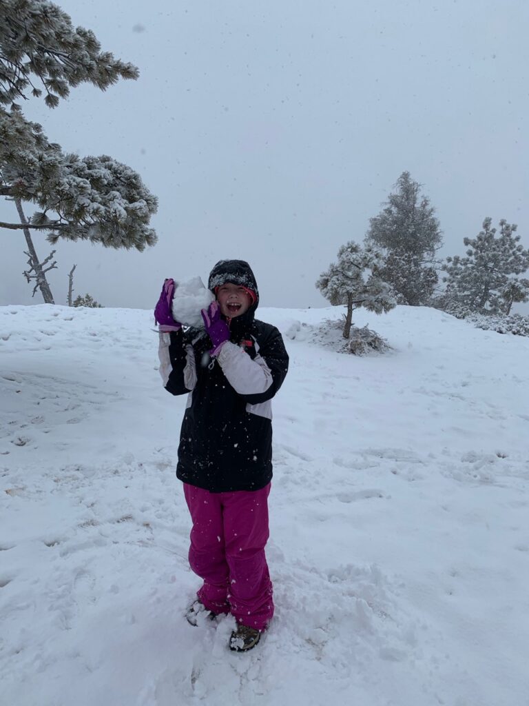 Cameron making a massive snowball in the mist of a snow storm in Bryce Canyon National Park. Taken near sunrise point.