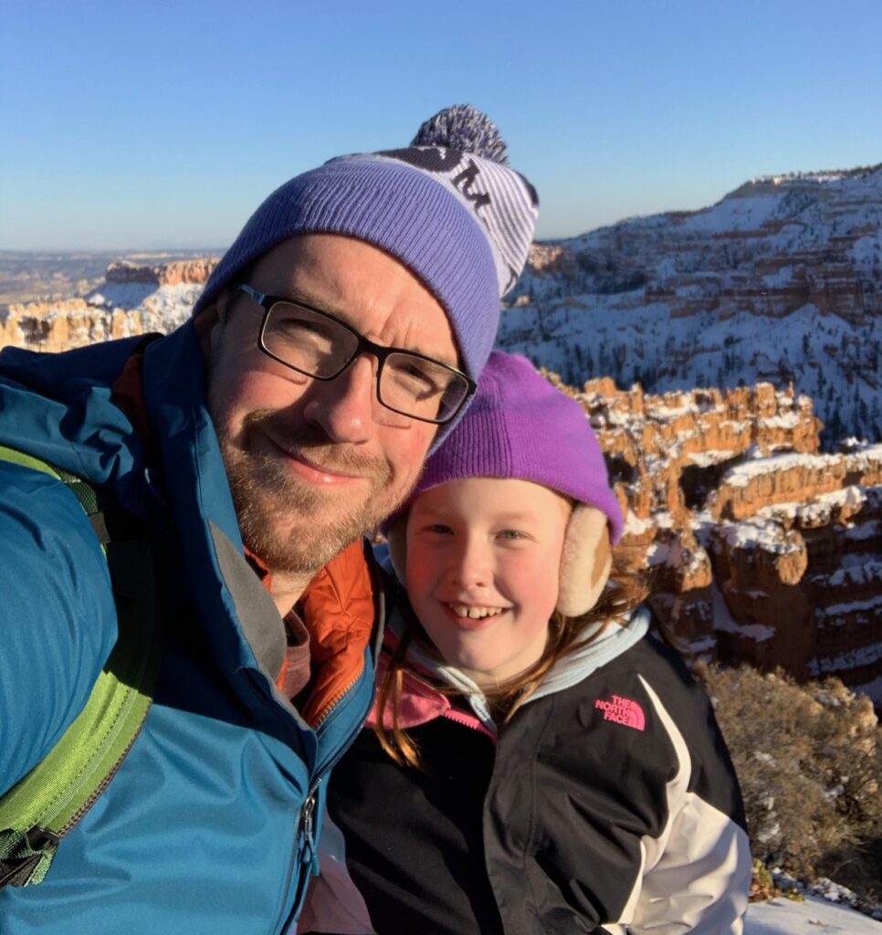 Cameron and myself standing in the freezing cold at Bryce Point - in Bryce Canyon National Park.