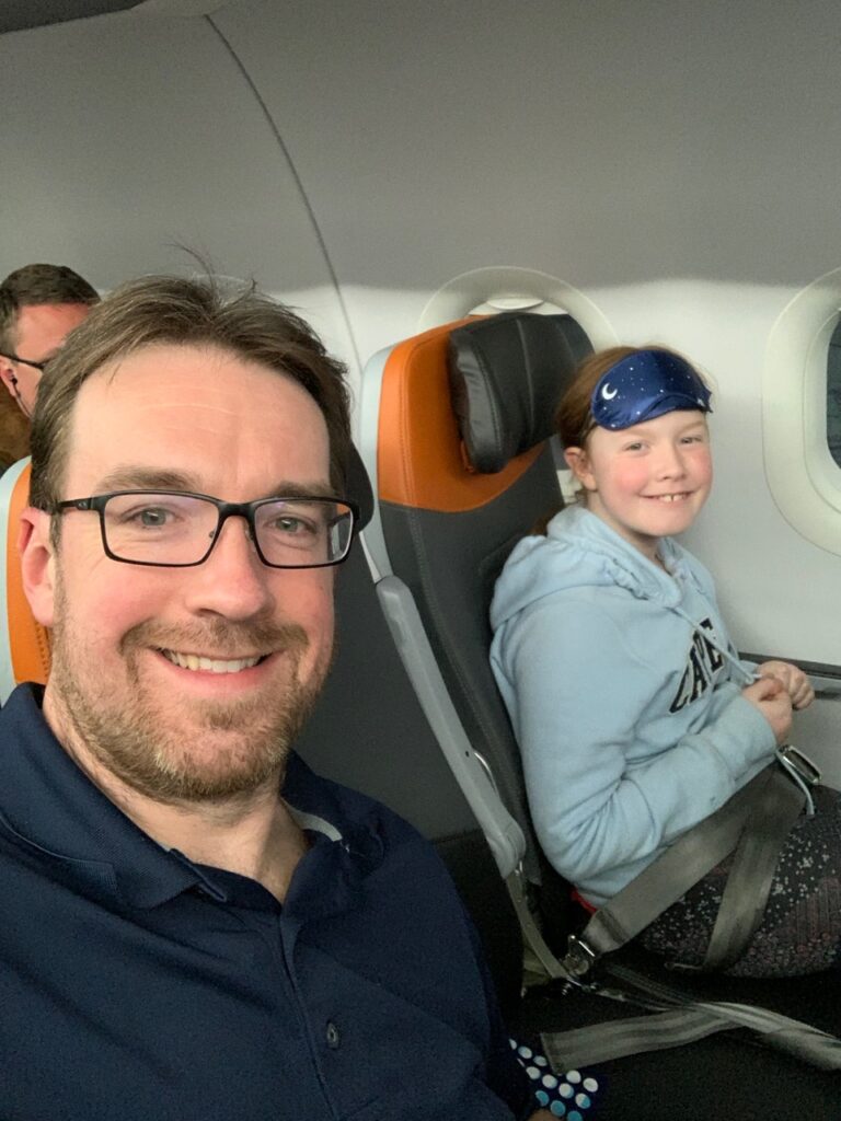 Cameron and myself sitting on the JetBlue airplane right before our red-eye flight home.