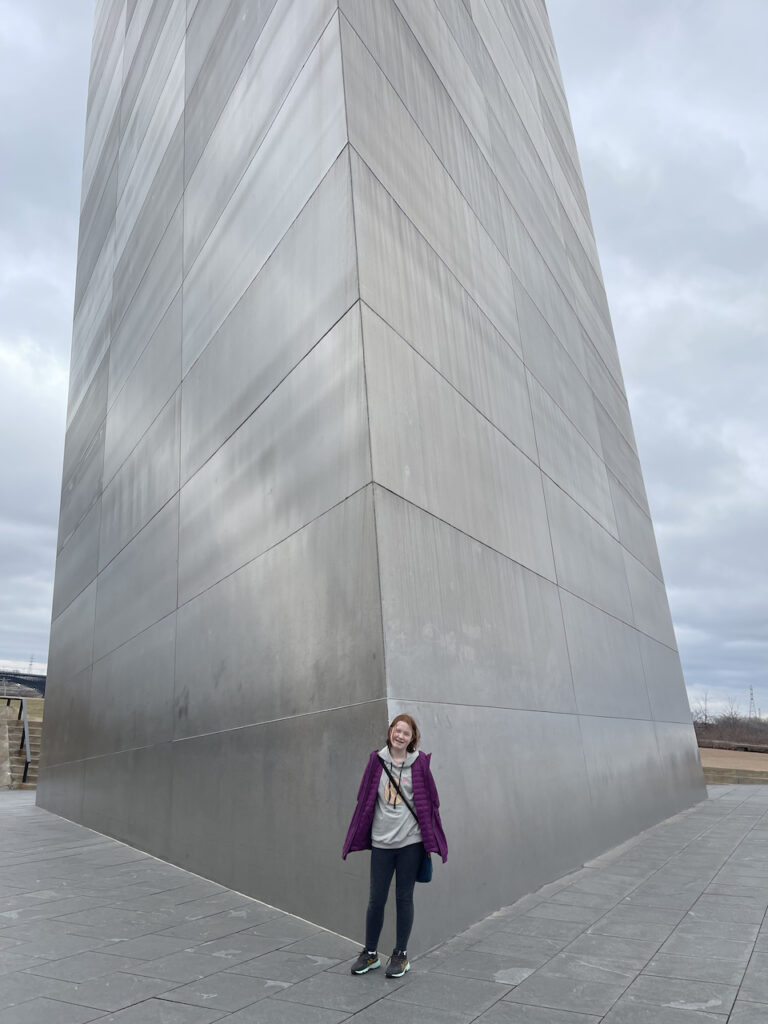 Cameron standing at the base of the Gateway arch.