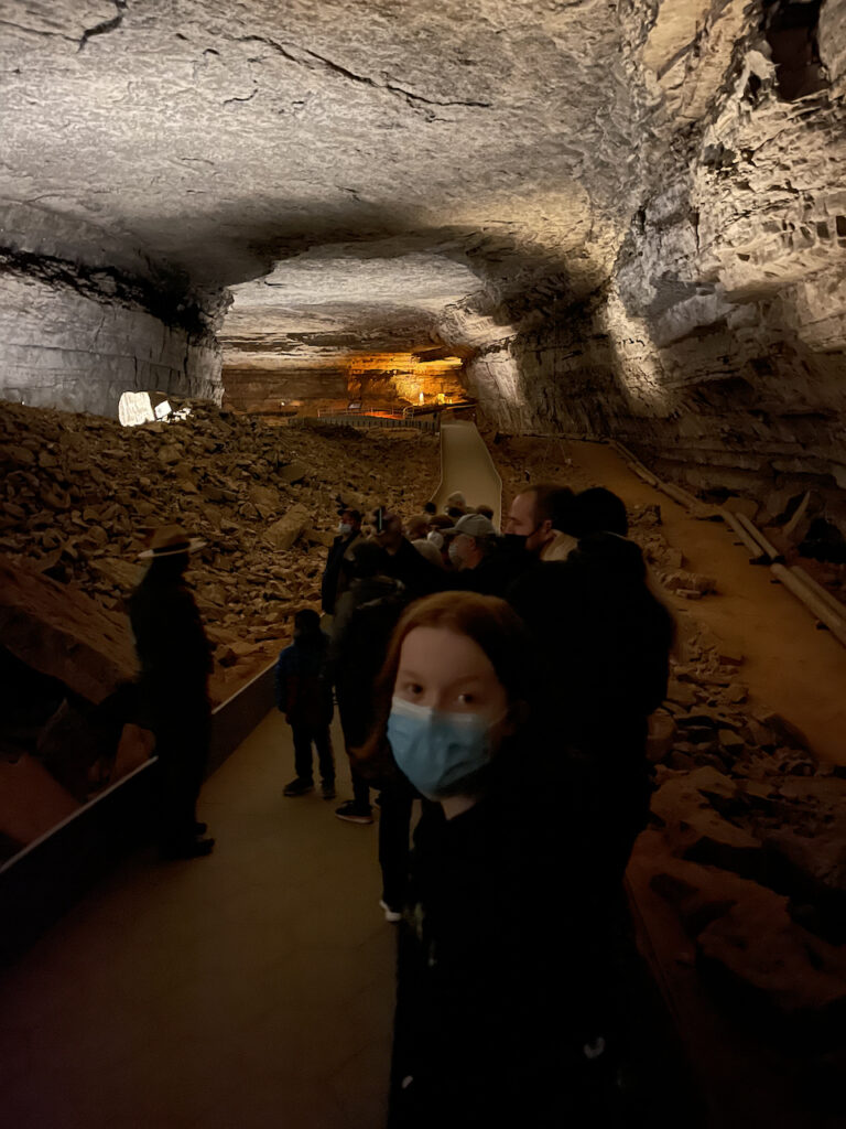 Cameron looking back at me in a the large tour group in one of the massive rooms in Mammoth Caves.