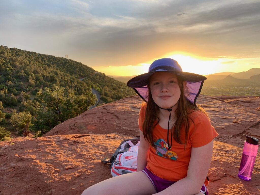 Cameron sitting at sunset on Airport Mesa in Sedona.