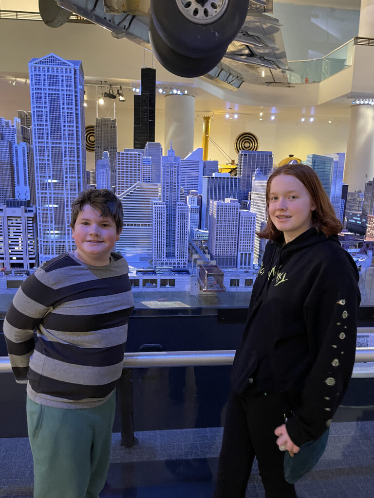 Cameron and Collin in front of a scale model of Chicago in the Museum of Science and Industry. 