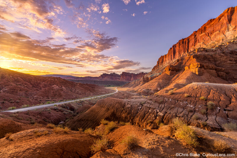 Scenic Drive in Capitol Reef at sunset with red sandstone, Moenkopi Formations, Waterpocket Fold, and colorful sky.