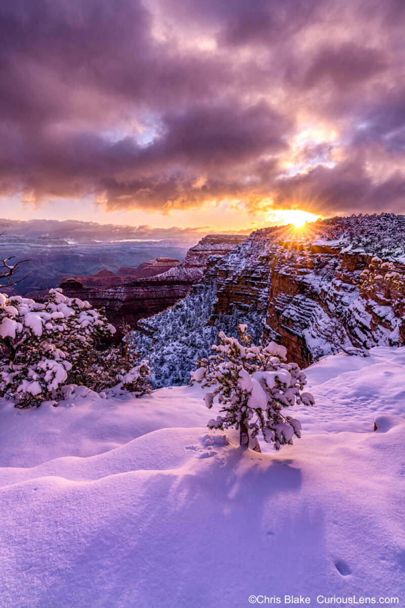 Winter storm breaking at sunrise over the Grand Canyon with dramatic clouds, vibrant colors, and majestic landscape.